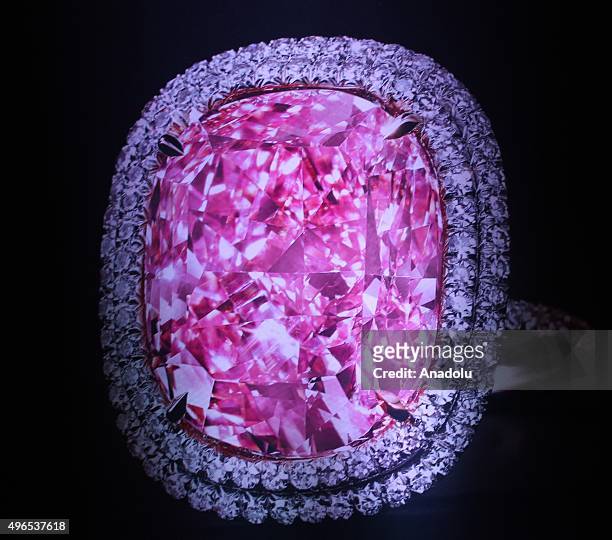 Carat vivid pink diamond set in a ring and rounded with a double row of smaller white diamonds has sold at auction for 28.7 million Swiss francs in...