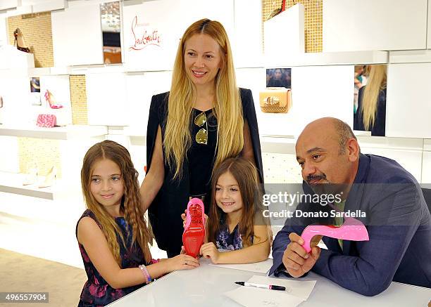 Designer Christian Louboutin spends time with customers at his personal appearance and shoe signing at Saks Fifth Avenue Beverly Hills on November...