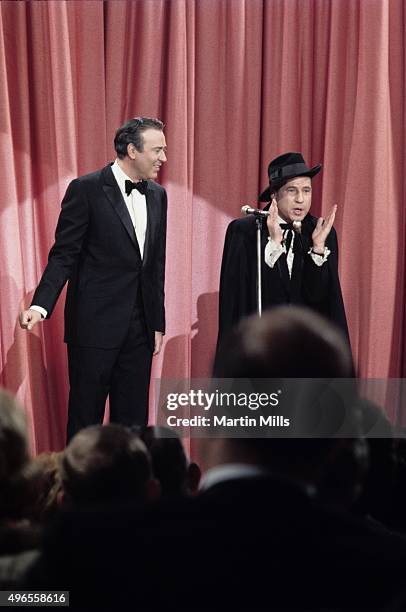 Comedians, writers and directors Carl Reiner and Mel Brooks perform their routine 'The 2000 Year Old Man' circa 1967 in Los Angeles, California.