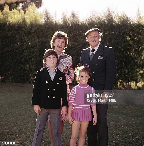 Singer, dancer and actor Gene Kelly poses for a portrait with his wife Jeanne Coyne and children Tim and Bridget at home circa 1971 in Beverly Hills,...