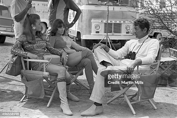 Entertainer Dean Martin as Matt Helm with cast members Senta Berger and Janice Rule on the set of the Columbia Pictures film 'The Ambushers' in 1967...