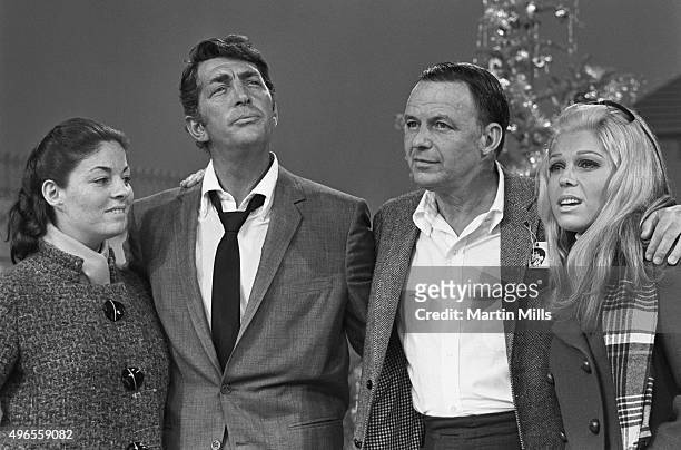 Entertainers Dean Martin and Frank Sinatra with daughters Deana Martin and Nancy Sinatra on the set of 'The Dean Martin Show' Christmas special in...