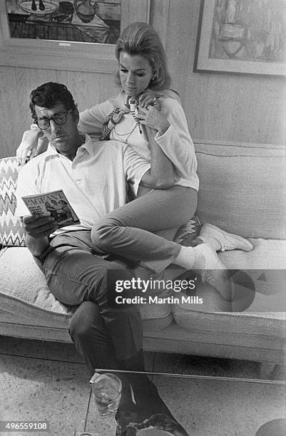 Entertainer Dean Martin with his wife Jeanne pose for a portrait in 1966 in Los Angeles, California.