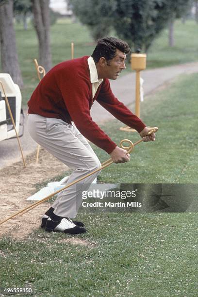 Entertainer Dean Martin hams it up during Jackie Gleason's Inverrary Classic golf tournament in Lauderhill, Florida.