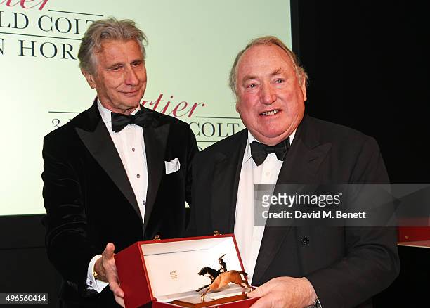 Anthony Oppenheimer accepts the 3 Year Old Colt award for "Golden Horn" from Arnaud Bamberger at the 25th Cartier Racing Awards at The Dorchester on...