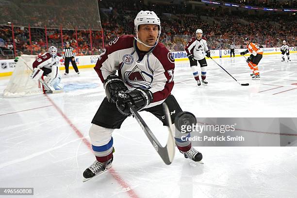 Francois Beauchemin of the Colorado Avalanche tries to control a loose puck against the Philadelphia Flyers in the second period at Wells Fargo...