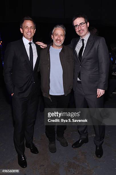 Comedians Seth Meyers, Jon Stewart, and John Oliver pose backstage at the New York Comedy Festival and the Bob Woodruff Foundation's 9th Annual Stand...