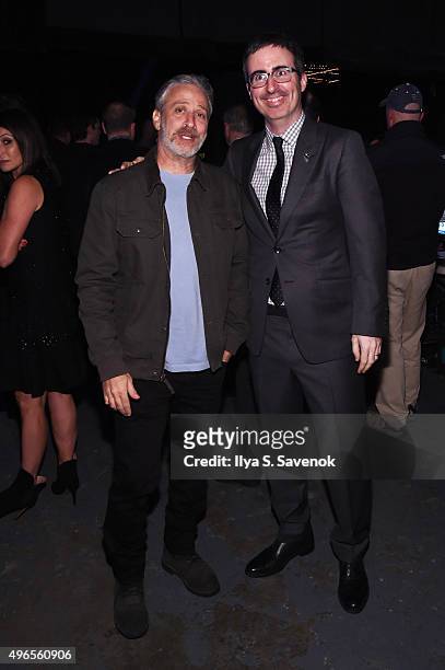 Comedians Jon Stewart and John Oliver pose backstage at the New York Comedy Festival and the Bob Woodruff Foundation's 9th Annual Stand Up For Heroes...