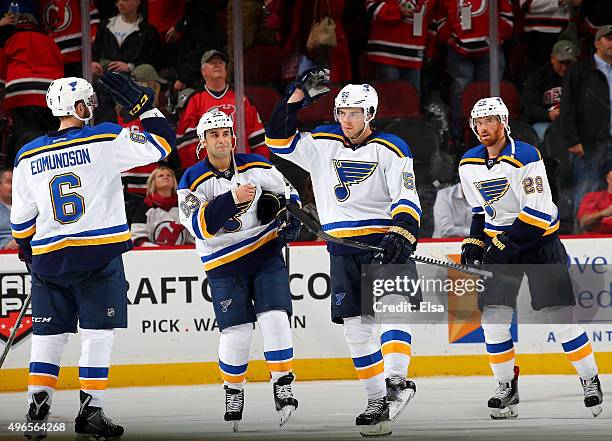Joel Edmundson,Scott Gomez,Magnus Paajarvi and Martin Havlat of the St. Louis Blues celebrate the win over the New Jersey Devils on November 10, 2015...