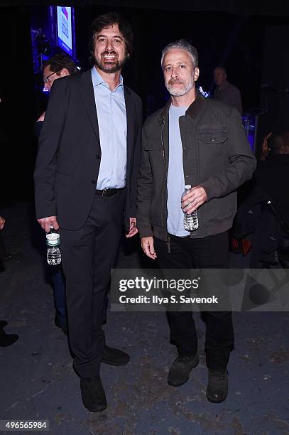 Comedians Ray Romano and Jon Stewart pose backstage at the New York Comedy Festival and the Bob Woodruff Foundation's 9th Annual Stand Up For Heroes...