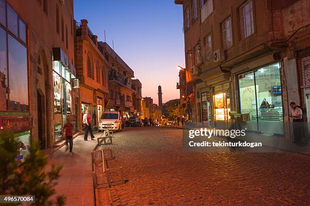 narrow street of middleeastern town mardin in turkey - touristical stock pictures, royalty-free photos & images