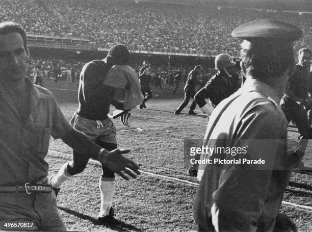 Pele hides his face as after his last game for Brazil, it was against Yugoslavia at the Maracana Stadium in Rio de Janeiro, 18th July 1971.