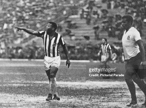 Brazilian footballer Pele playing for Santos against Corinthians, 1969.
