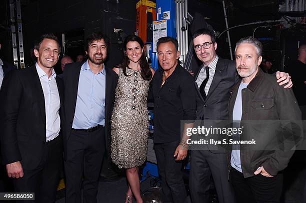 Seth Meyers, Ray Romano, Lydia Fenet, Bruce Springsteen, John Oliver, and Jon Stewart pose backstage at the New York Comedy Festival and the Bob...