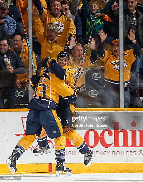 Barret Jackman celebrates his goal with Colin Wilson of the Nashville Predators against the Ottawa Senators during an NHL game at Bridgestone Arena...