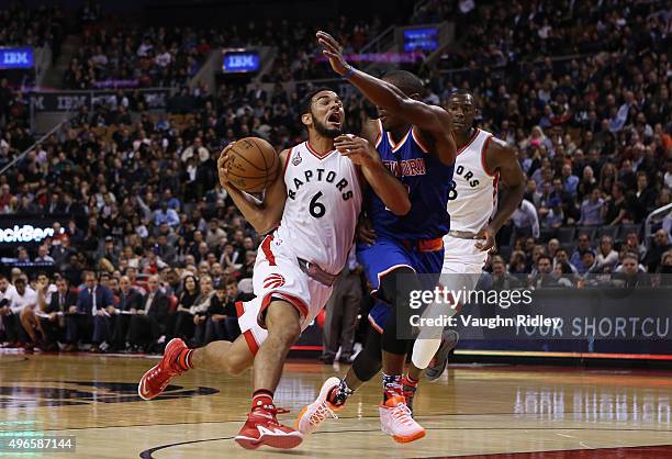 Cory Joseph of the Toronto Raptors drives against Langston Galloway of the New York Knicks defends during an NBA game at the Air Canada Centre on...