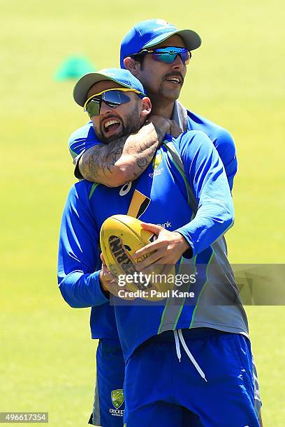 Mitchell Johnson wrestles with Nathan Lyon as players warm up during an Australian nets session at WACA on November 11, 2015 in Perth, Australia.