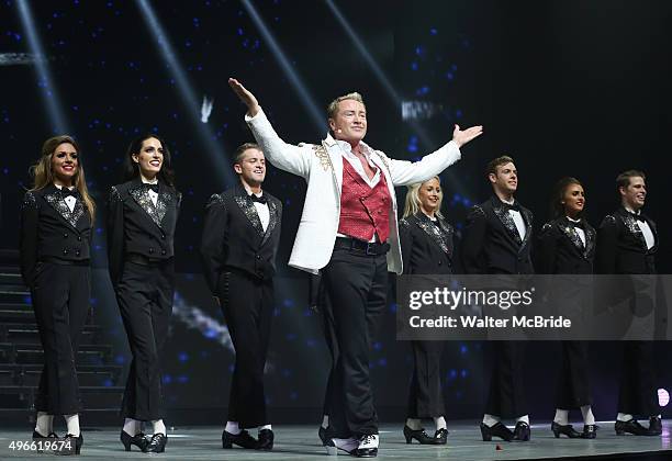 Michael Flatley with the cast onstage during the curtain call for the Broadway Opening and debut of 'Lord of the Dance: Dangerous Games' at The Lyric...