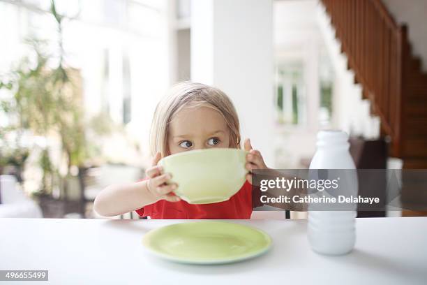 a 3 years old girl taking her breakfast - 2 3 years one girl only stock-fotos und bilder