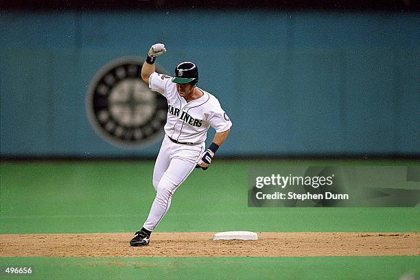 Edgar Martinez of the Seattle Mariners runs around second base after hitting a grand slam during the game against the New York Yankees at the...