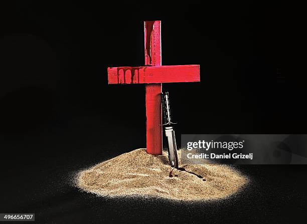 still life symbolizing violence - christianity black background stock pictures, royalty-free photos & images