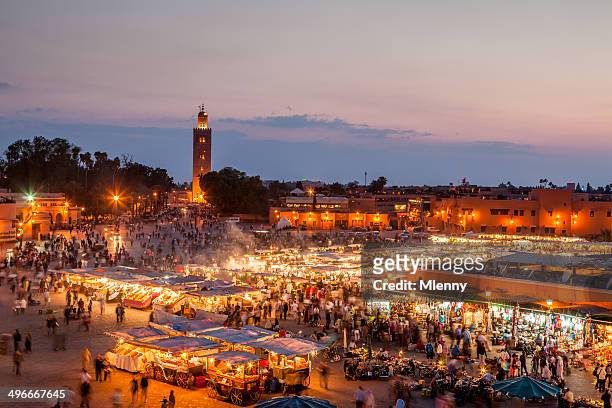 djemma el fna marrakech by night - marrakech morocco stock pictures, royalty-free photos & images