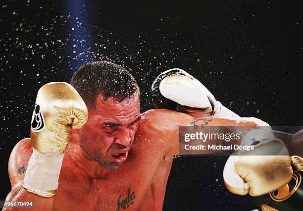 Anthony Mundine of Australia is hit by Charles Hatley of the USA during their bout at The Melbourne Convention and Exhibition Centre on November 11,...