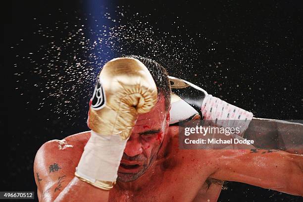 Anthony Mundine of Australia is hit by Charles Hatley of the USA during their bout at The Melbourne Convention and Exhibition Centre on November 11,...