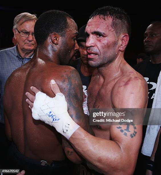 Defeated Anthony Mundine of Australia and Charles Hatley of the USA hug after their bout at The Melbourne Convention and Exhibition Centre on...