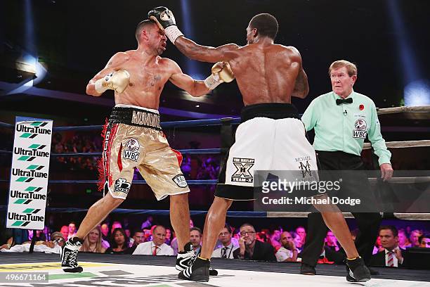 Anthony Mundine of Australia is hit by Charles Hatley of the USA during their bout at The Melbourne Convention and Exhibition Centre on November 11,...