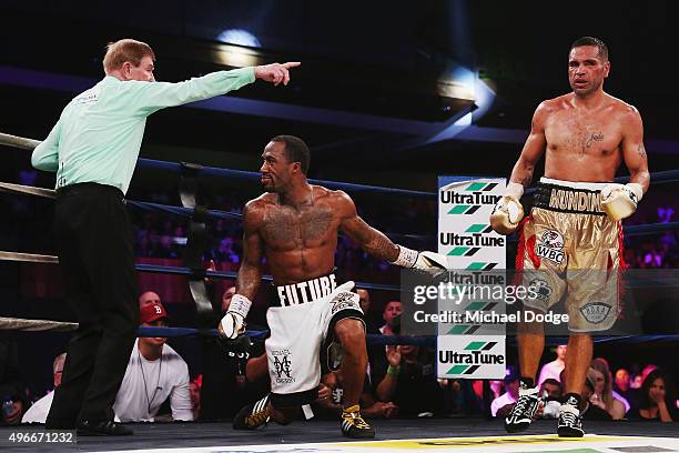 Anthony Mundine of Australia knocks down Charles Hatley of the USA during their bout at The Melbourne Convention and Exhibition Centre on November...