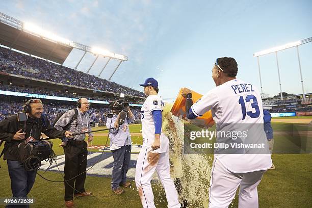 Baseball ALCS Playoffs: Kansas City Royals Salvador Perez victorious, pouring Gatorade on on Eric Hosmer after winning Game 2 vs Toronto Blue Jays at...