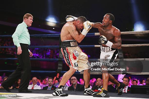 Anthony Mundine of Australia is hit by Charles Hatley of the USA during their bout at The Melbourne Convention and Exhibition Centre on November 11,...