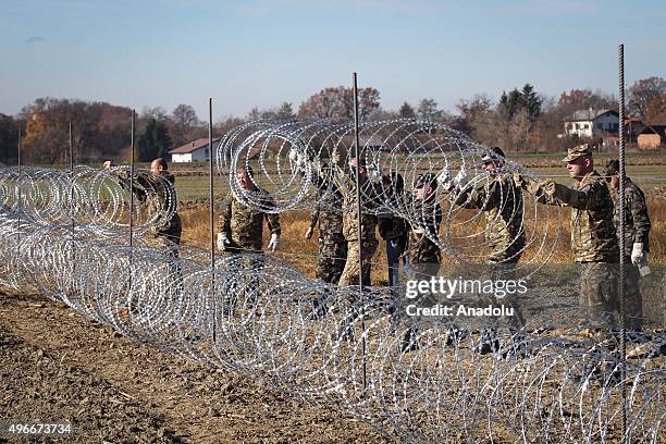 Members of the Slovenia Defence Force install fences on the Slovenian-Croatian border to prevent refugees to enter Europe in Brezice, Slovenia on...