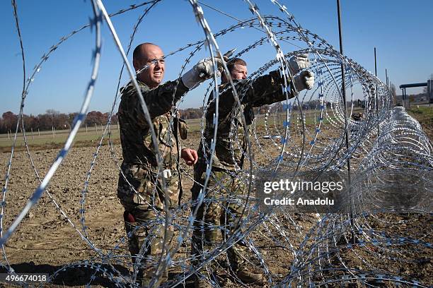 Members of the Slovenia Defence Force install fences on the Slovenian-Croatian border to prevent refugees to enter Europe in Brezice, Slovenia on...