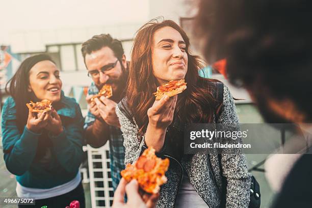 pizza time on the roof - pepperoni slice stock pictures, royalty-free photos & images