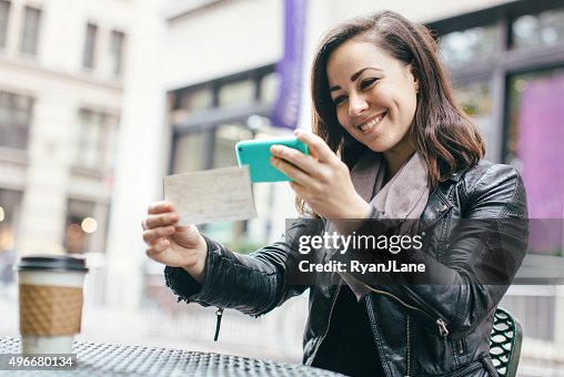 New York Woman Depositing Check Remotely New York Woman Depositing Check Remotely