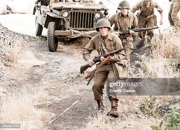 soldiers on patrol wwii - ww2 jeep stock pictures, royalty-free photos & images