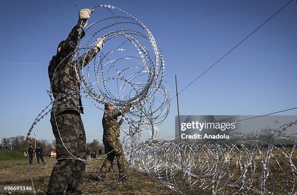 Members of the Slovenia Defence Force install fences on the Slovenian-Croatian border to prevent refugees to enter Europe in Brezice, Slovenia on...