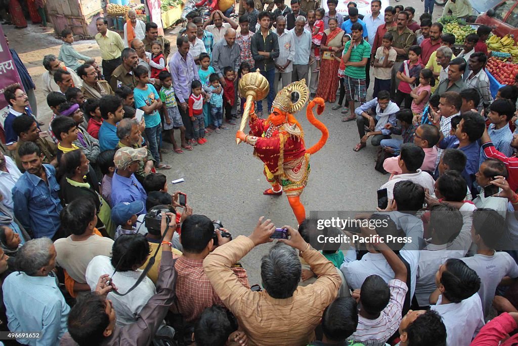 A devotee dressed as a monkey God Lord Hanuman during the...