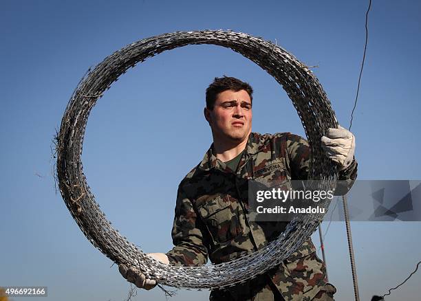 Members of the Slovenia Defence Force install fences on the Slovenian-Croatian border to prevent refugees to enter Europe in Brezice, Slovenia on...