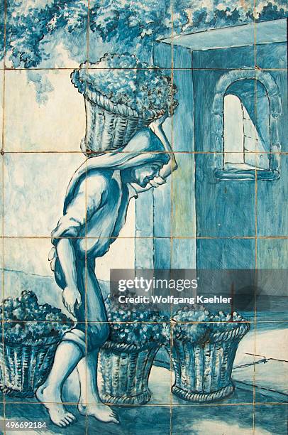 Portuguese tiles picturing the wine harvest in a winery in the city of Funchal on the Portuguese island of Madeira.