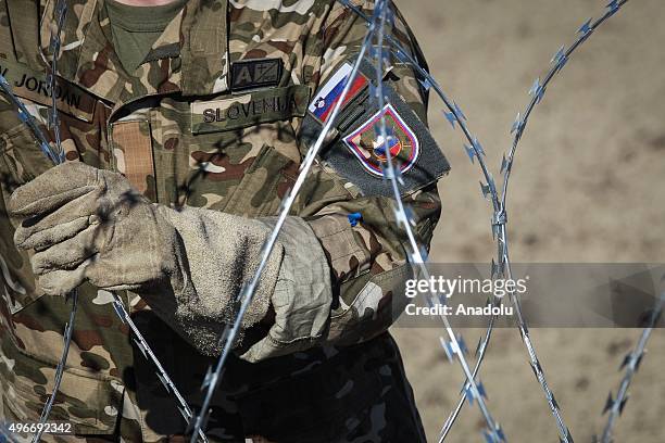 Members of the Slovenia Defence Force install fences on the Slovenian-Croatian border to prevent refugees to enter Europe in Brezice, Slovenia on...