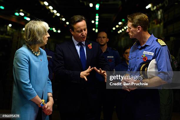 Home Secretary Theresa May and British Prime Minister David Cameron receive a tour of HMS Bulwark during the Valletta Summit on migration on November...