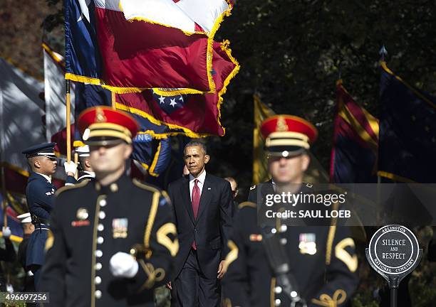 President Barack Obama arrives for a wreath laying ceremony at the Tomb of the Unknown Soldier in honor of Veteran's Day at Arlington National...