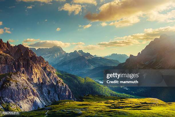 mountains and valley at sunset - valley stock pictures, royalty-free photos & images