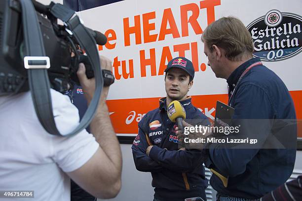 Dani Pedrosa of Spain and Repsol Honda Team speaks with journalists at the end of the second day of test during the MotoGp Tests In Valencia at...