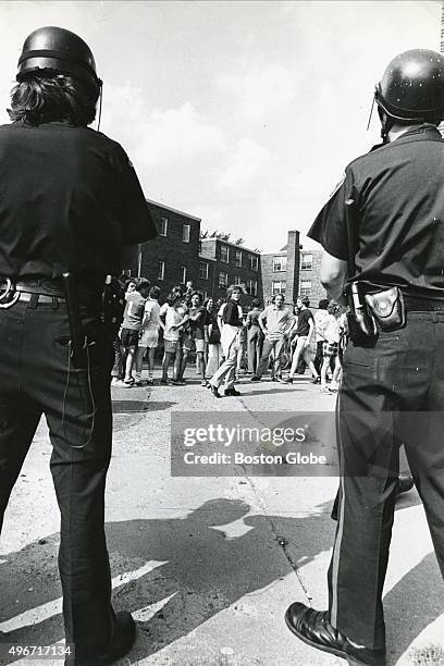Police officers stands guard in South Boston, Mass. On Sept. 13 on the second day of school under the new busing system put in place to desegregate...