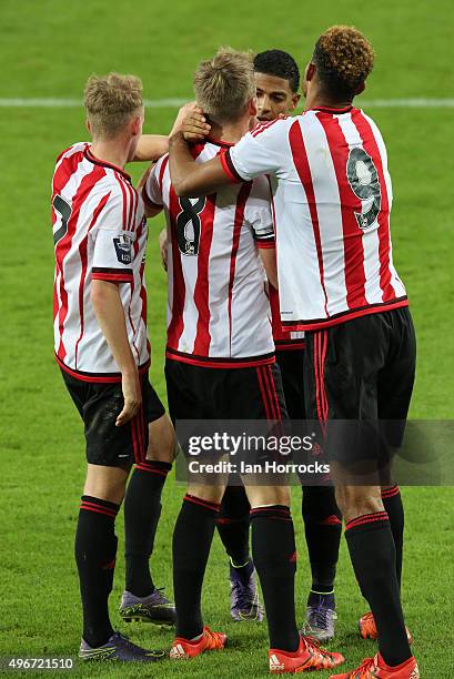 Sunderland players swamp Martin Smith of Sunderland after he scores the winning goal from the penalty spot during the Barclays Premier League...