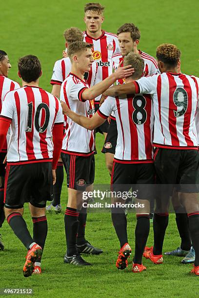 Sunderland players swamp Martin Smith of Sunderland after he scores the winning goal from the penalty spot during the Barclays Premier League...